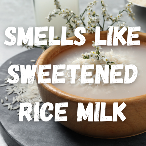 A photograph of a rustic wooden bowl with white rice grains floating in rice milk, adorned with a sprig of tiny white flowers. The words, "smells like sweetened rice milk" overlay the image.